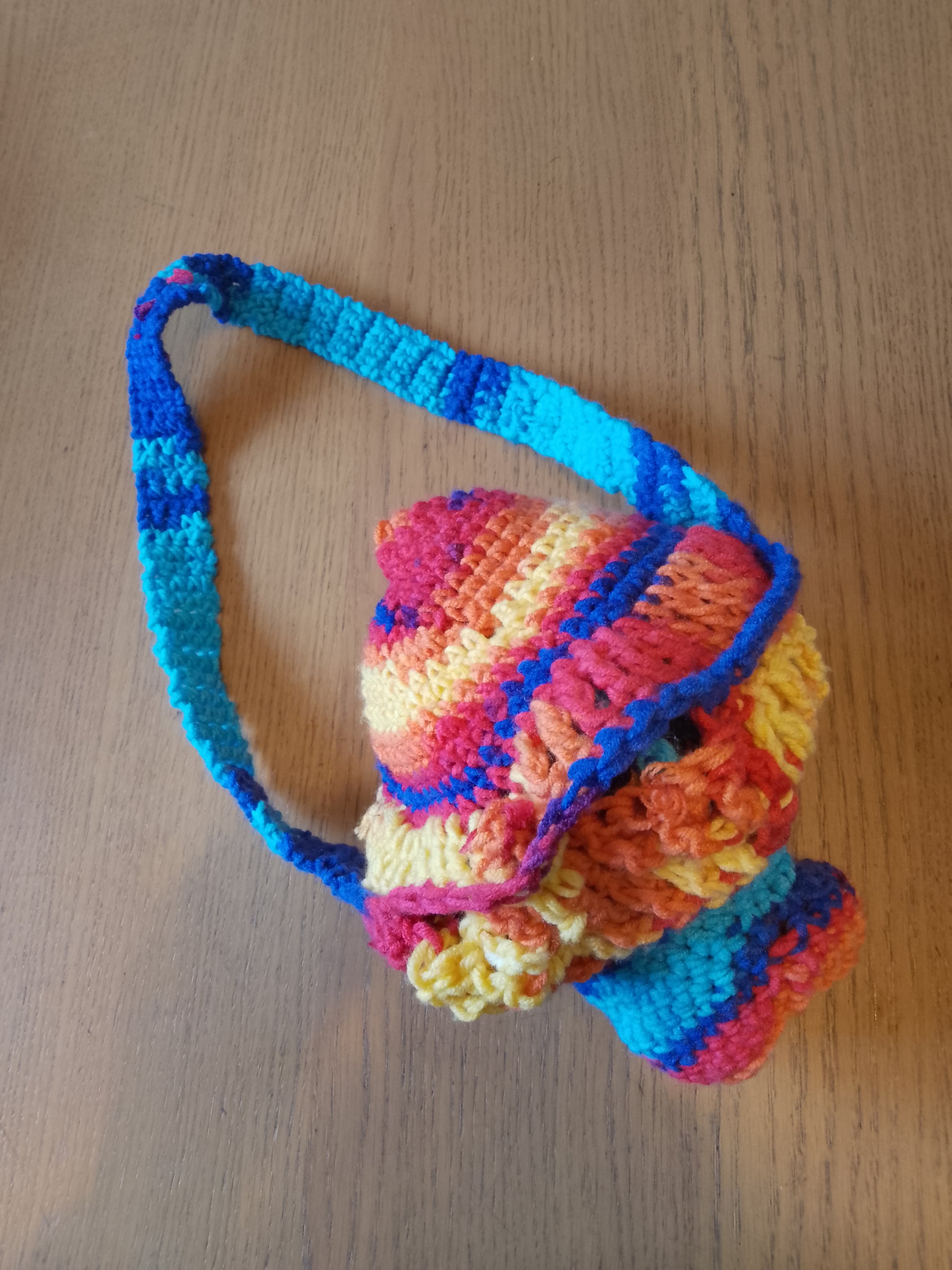 Colourful crochet mushroom bag closed